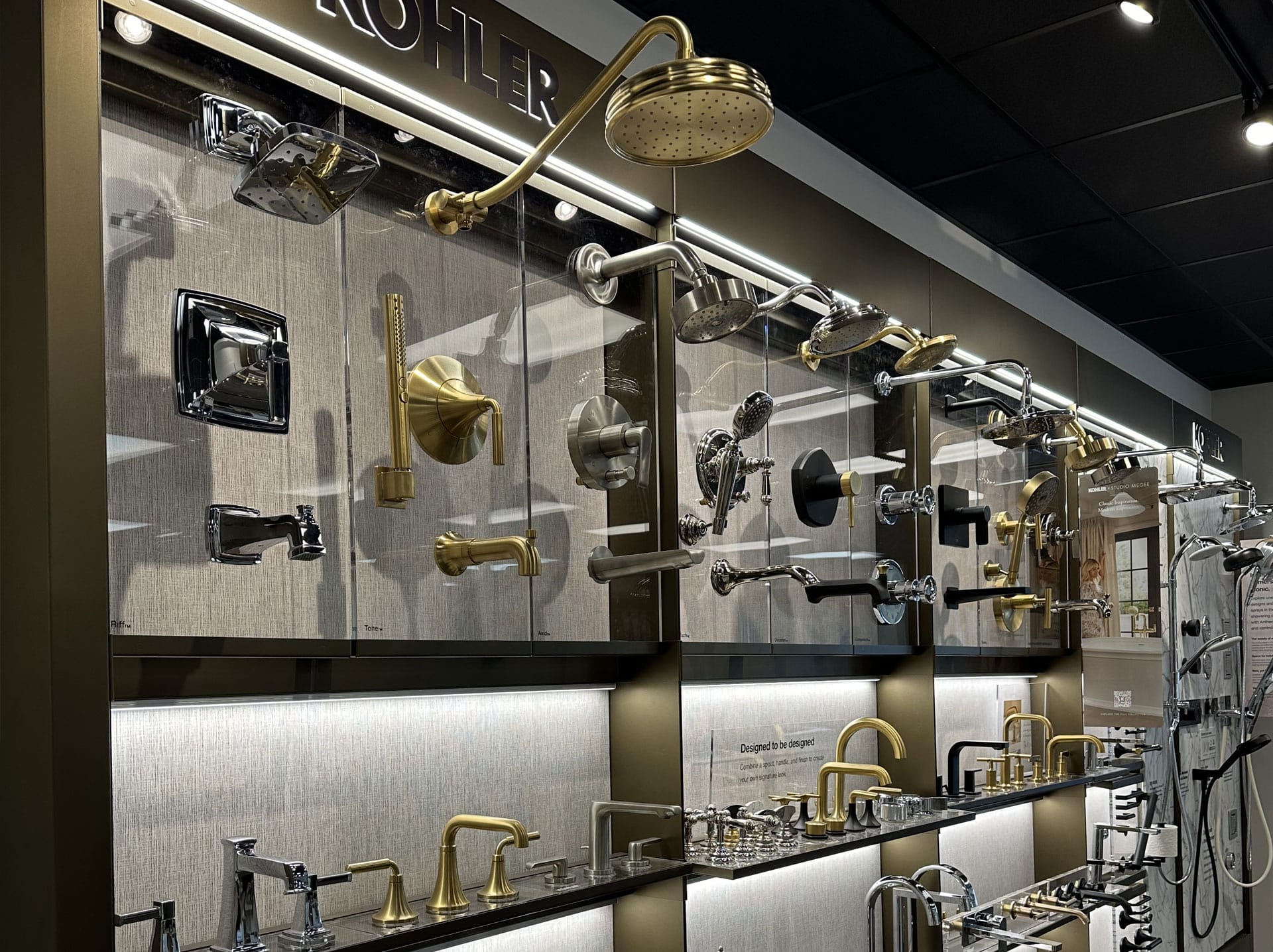 Plumbing supply showroom wall with multiple bathroom faucets